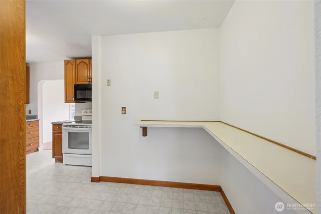 a view of a hallway with a kitchen