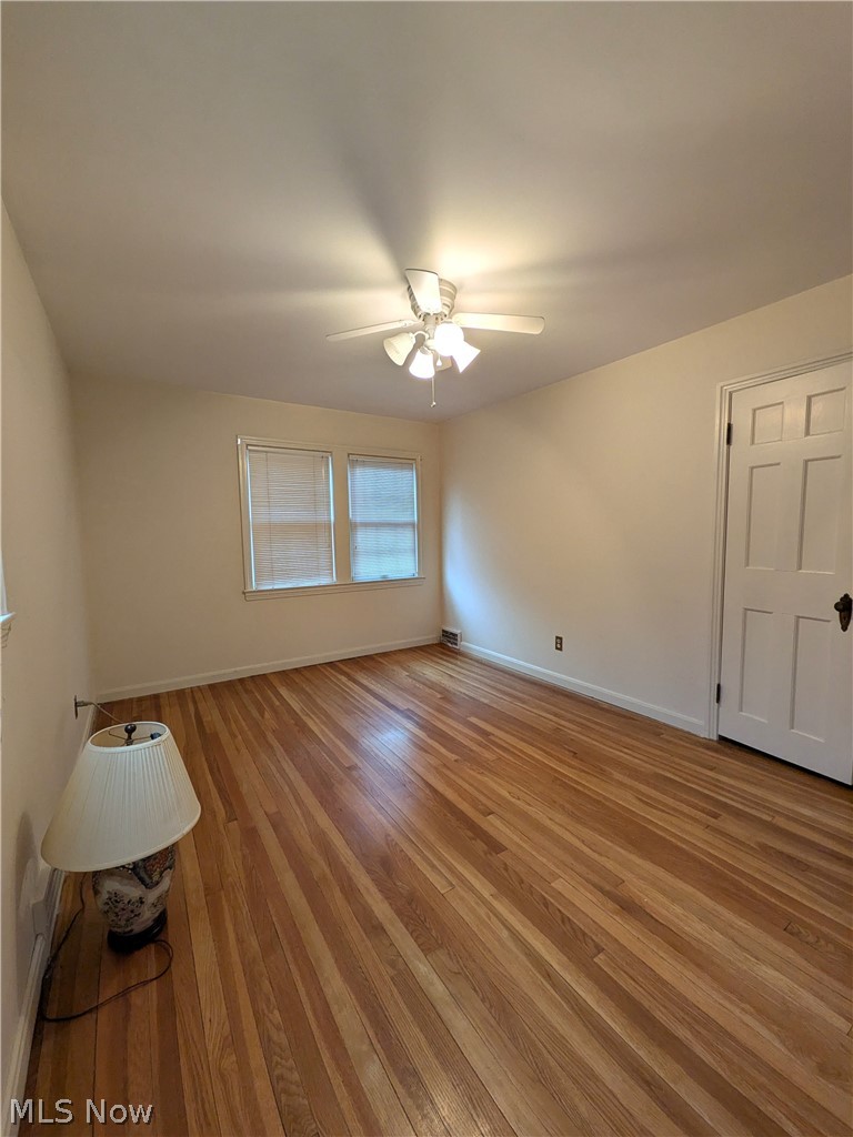2316 Glendon Road Cleveland, OH 44118 - Photo 15 of 22 Spare room featuring wood-type flooring and ceiling fan