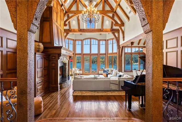 a living room with fireplace furniture and a flat screen tv