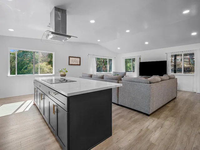 a kitchen with stainless steel appliances a sink stove and refrigerator