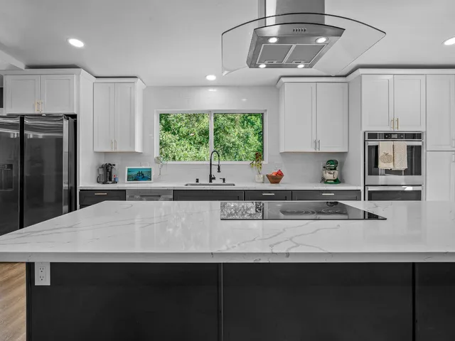 a large kitchen with a large island in it
