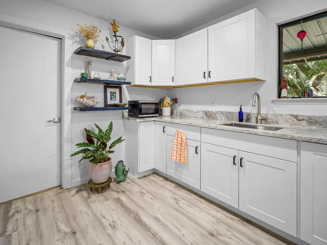 a kitchen with stainless steel appliances granite countertop a stove and a sink