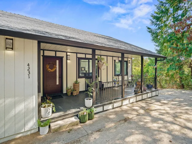 a outdoor living space with furniture and wooden floor