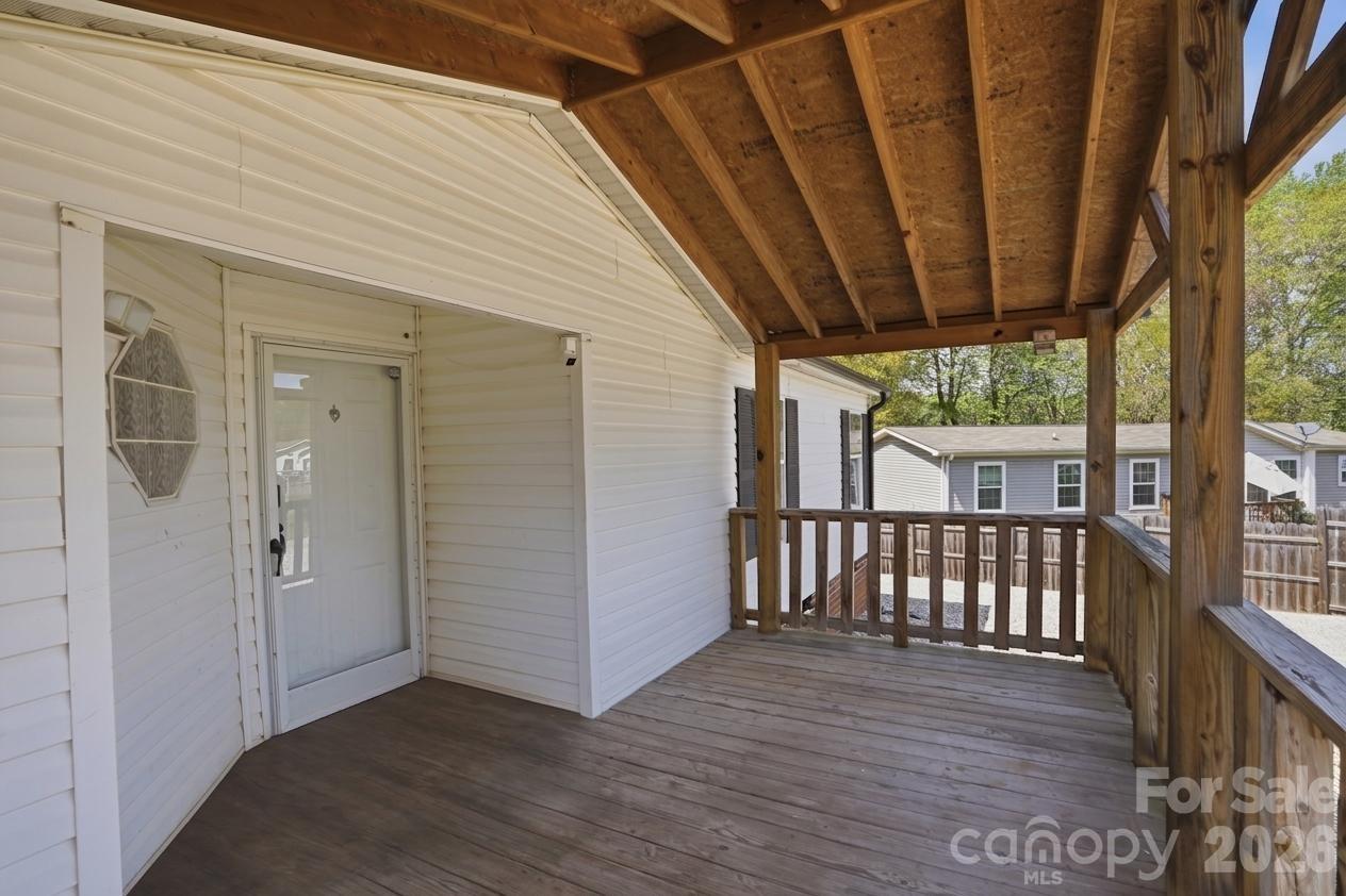 605 Ridgewood Court Mount Holly, NC 28120 - Photo 29 of 32 a view of a porch with wooden floor and outdoor space