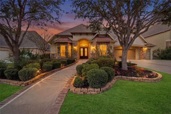 a front view of a house with garden