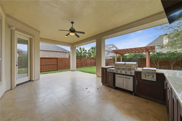 a open kitchen with stainless steel appliances granite countertop a stove and cabinets
