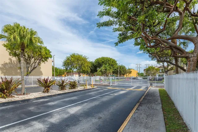 a view of a street with houses on both side