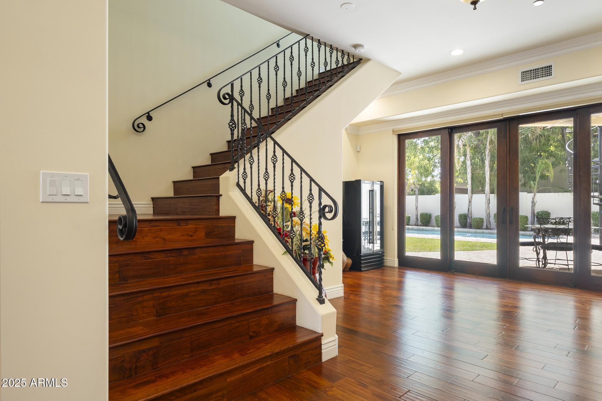 229 West Vista Avenue Phoenix, AZ 85021 - Photo 16 of 113 a view of staircase with wooden floor and white walls