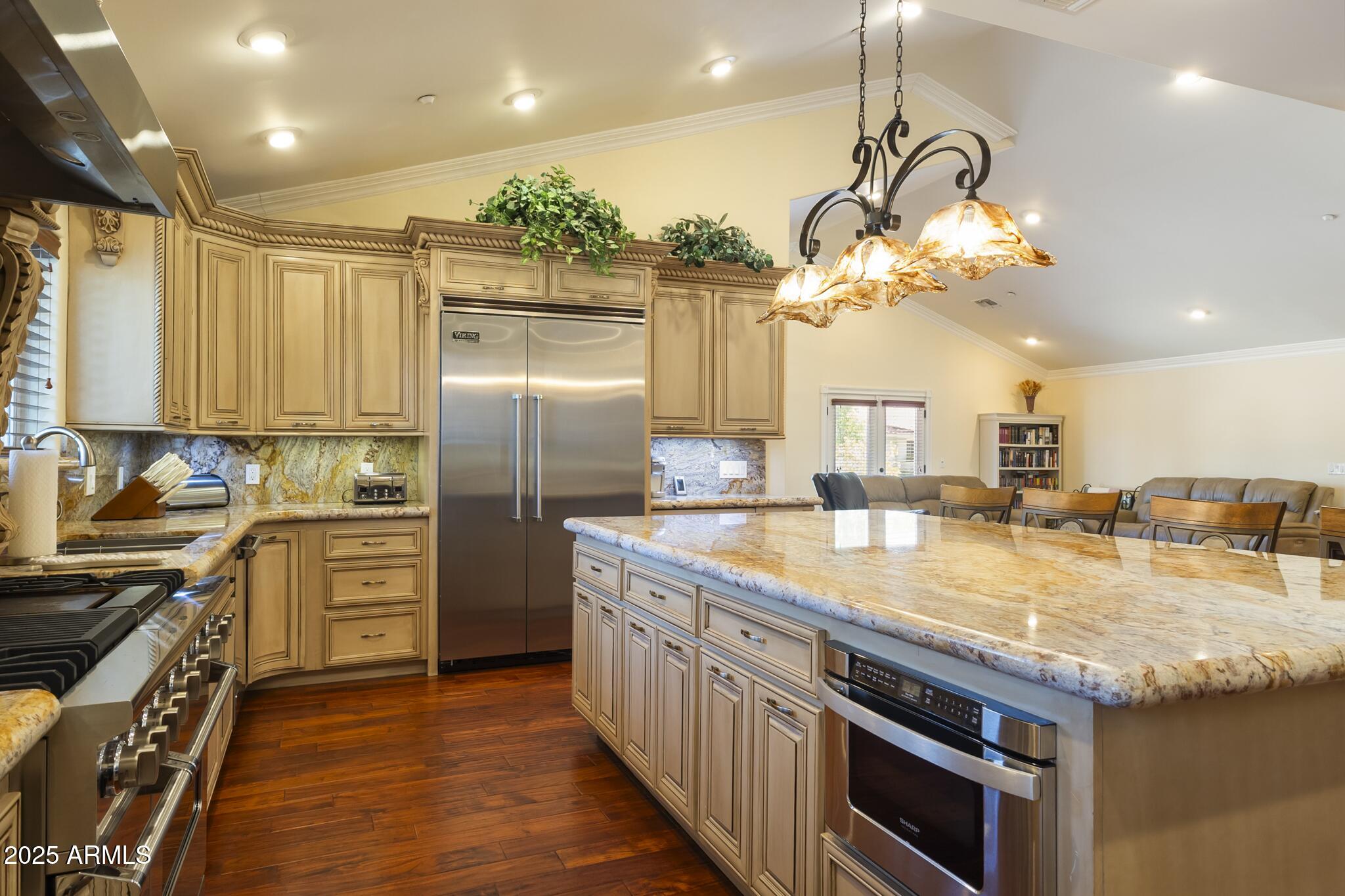 229 West Vista Avenue Phoenix, AZ 85021 - Photo 29 of 113 a kitchen with kitchen island granite countertop stainless steel appliances a sink stove and refrigerator