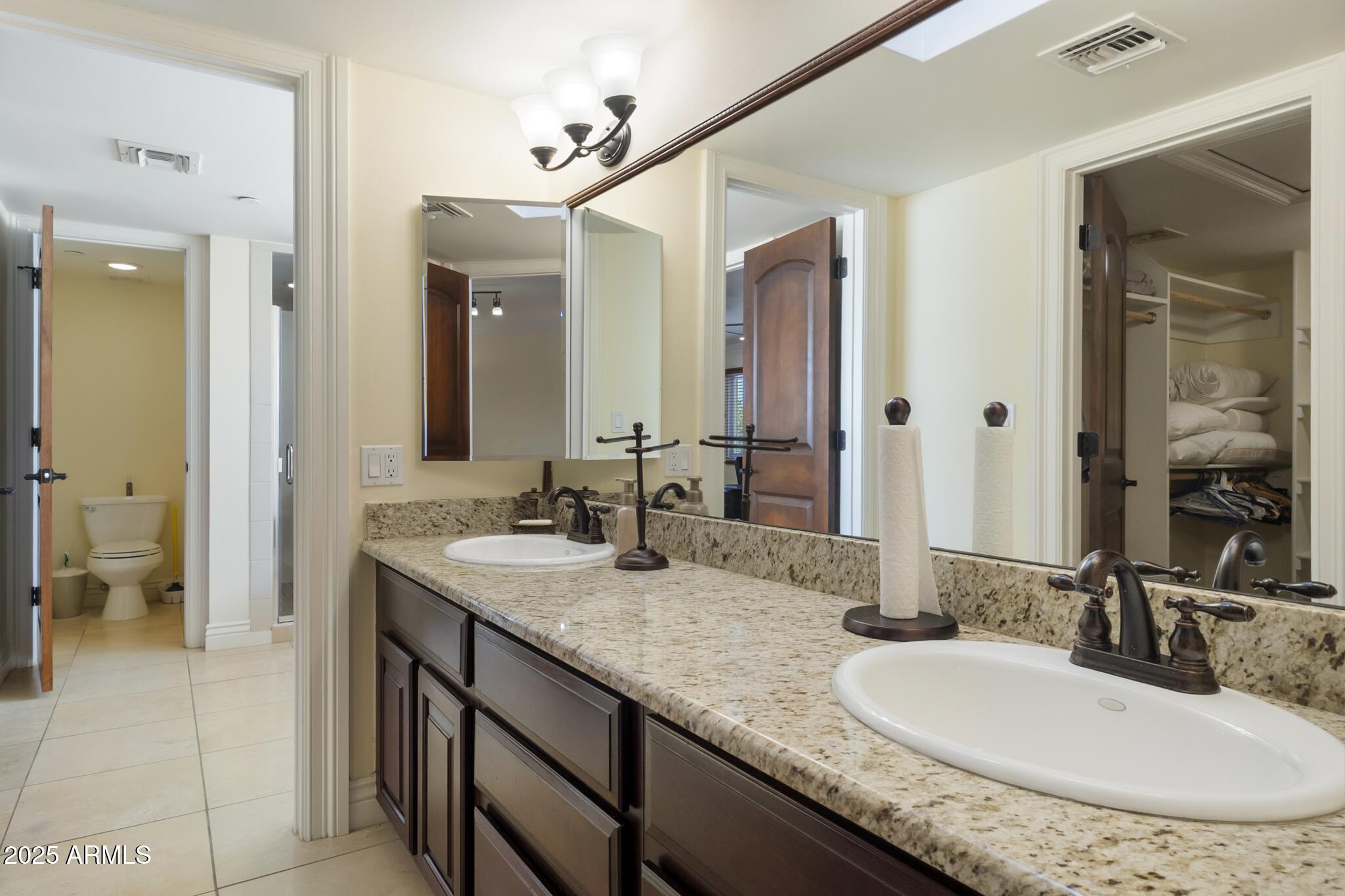 229 West Vista Avenue Phoenix, AZ 85021 - Photo 47 of 113 a bathroom with a granite countertop sink double and a mirror