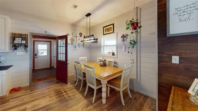 a bed room with a bed and a chair