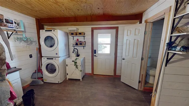 a living room with furniture cabinets and a flat screen tv