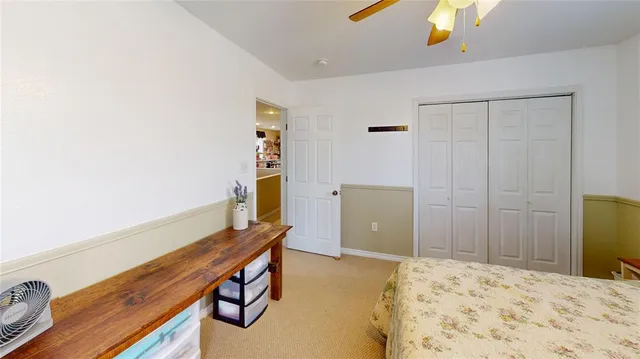 a bathroom with a bathtub and a view of bathroom
