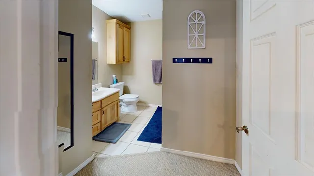 a view of a livingroom with workspace and a window