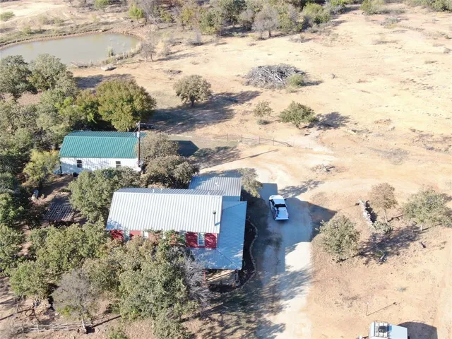 a view of a yard with a car parked in it