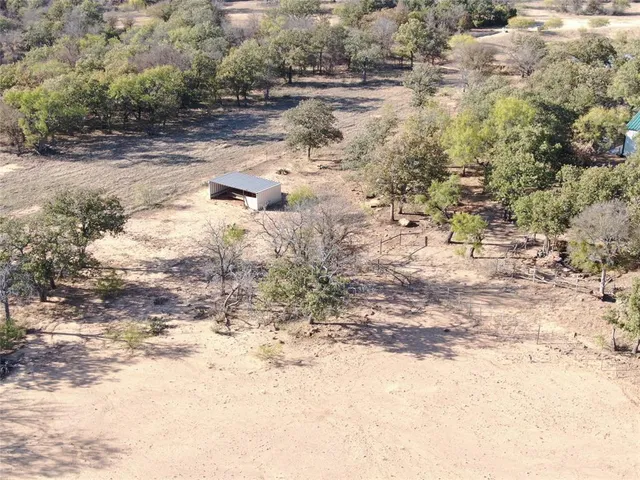 a view of a backyard with sitting area