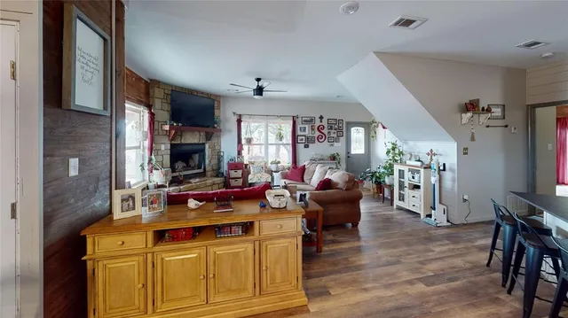 a kitchen with stainless steel appliances granite countertop a refrigerator sink and cabinets