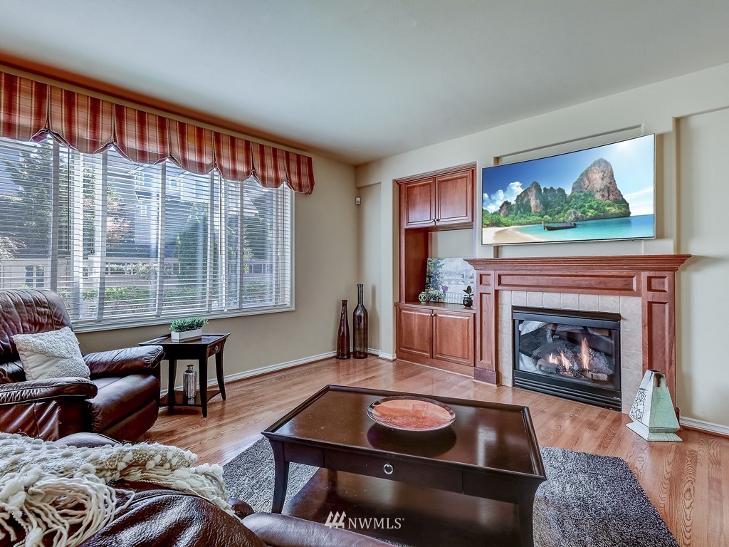 17070 Parkside Way Southeast Renton, WA 98058 - Photo 13 of 25 a living room with furniture and a fireplace