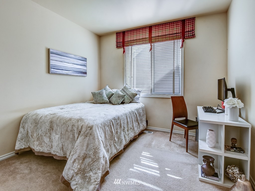 17070 Parkside Way Southeast Renton, WA 98058 - Photo 17 of 25 a bedroom with a bed and a window