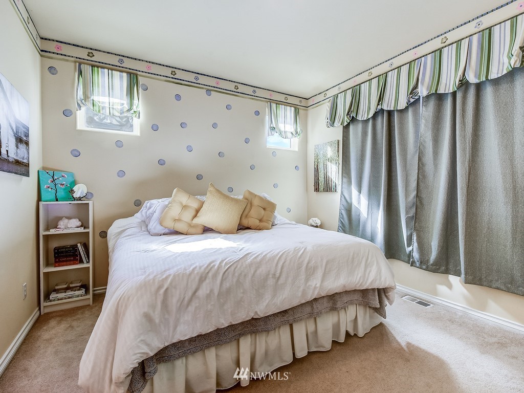 17070 Parkside Way Southeast Renton, WA 98058 - Photo 18 of 25 a bedroom with a bed and a window