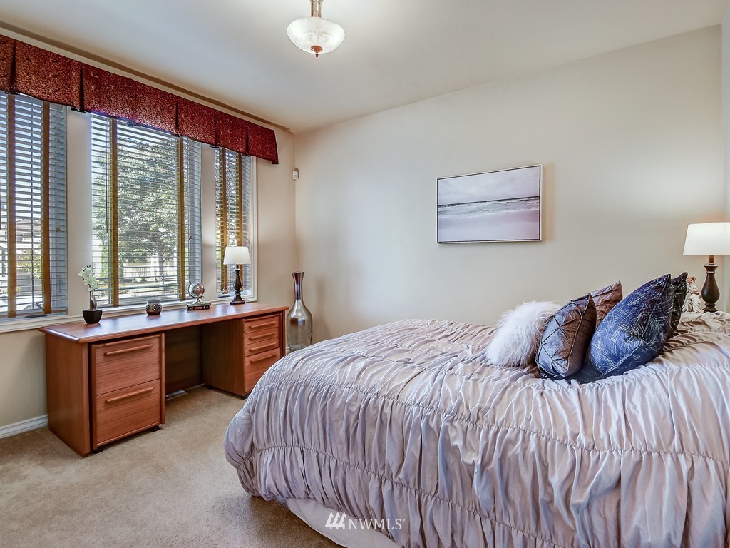 17070 Parkside Way Southeast Renton, WA 98058 - Photo 22 of 25 a bedroom with a large bed and a large window