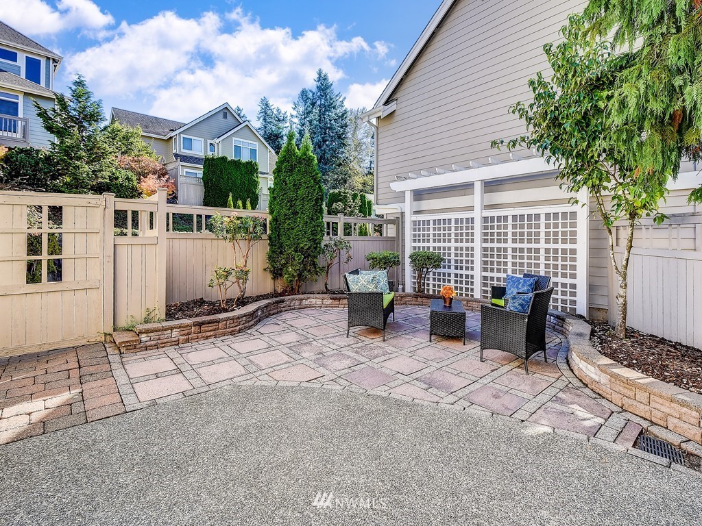 17070 Parkside Way Southeast Renton, WA 98058 - Photo 25 of 25 a view of a patio with a table and chairs and potted plants