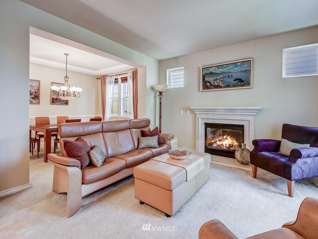 17070 Parkside Way Southeast Renton, WA 98058 - Photo 4 of 25 a living room with furniture and a fireplace