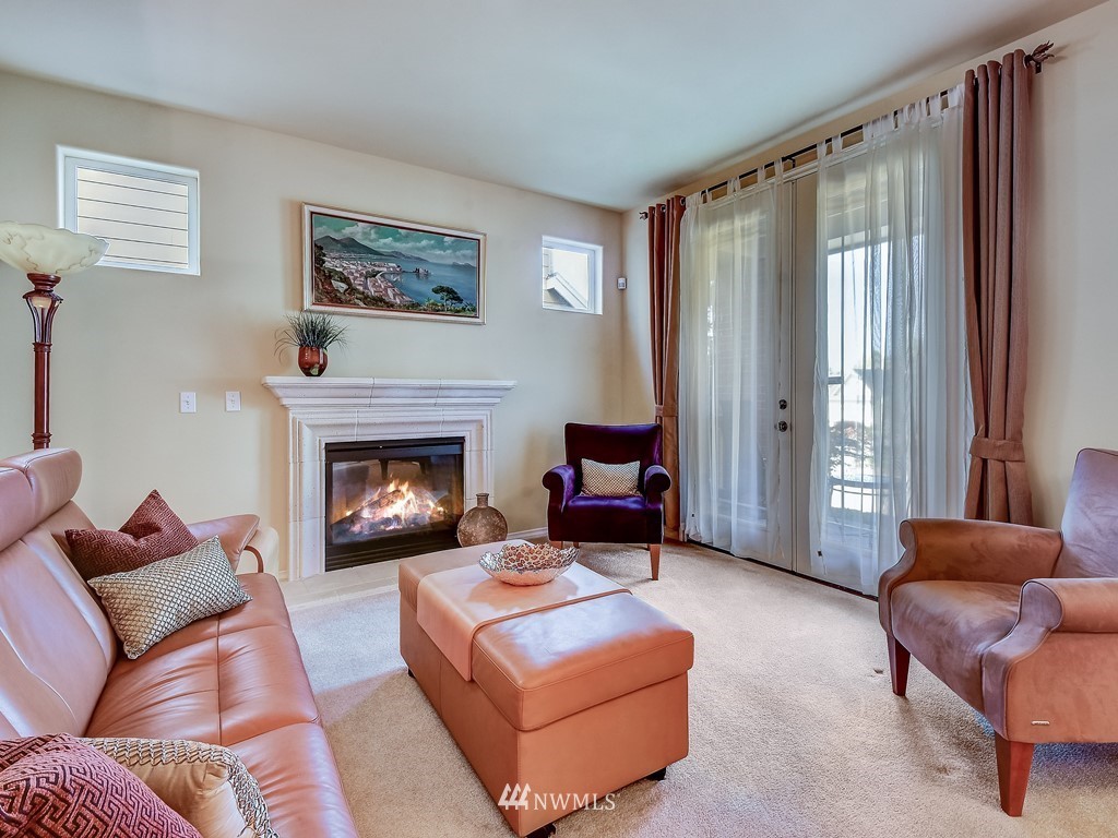 17070 Parkside Way Southeast Renton, WA 98058 - Photo 5 of 25 a living room with furniture and a fireplace