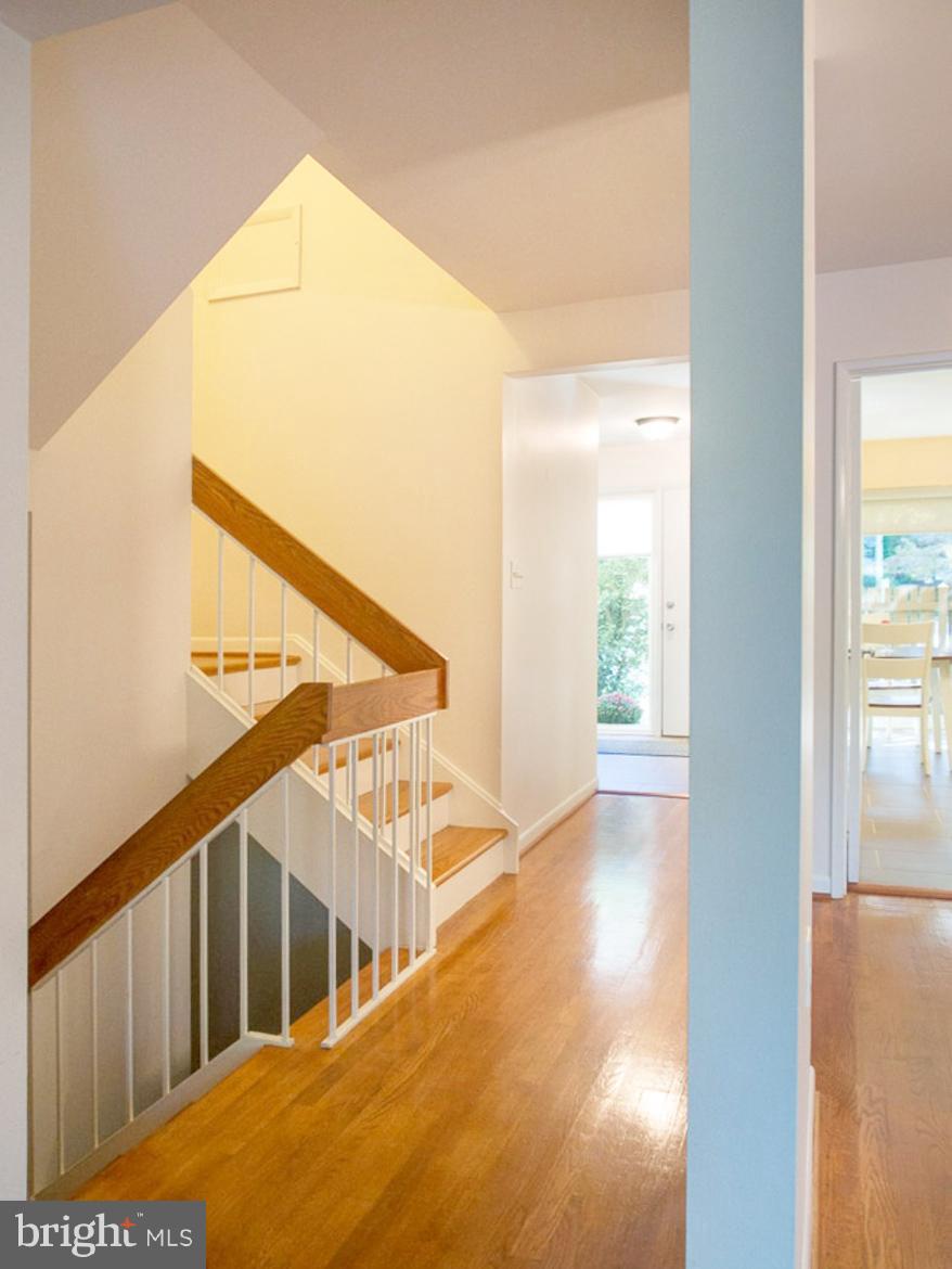 11168 Saffold Way Reston, VA 20190 - Photo 11 of 28 a view of staircase with railing and white walls