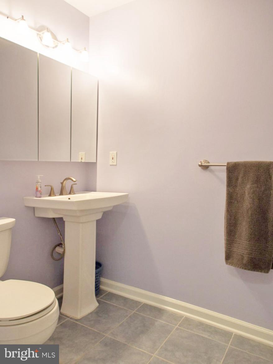 11168 Saffold Way Reston, VA 20190 - Photo 14 of 28 a bathroom with a sink and a toilet