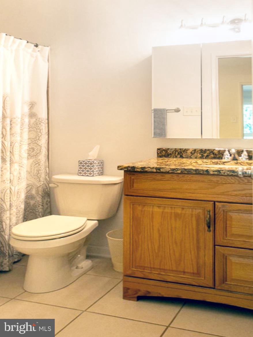 11168 Saffold Way Reston, VA 20190 - Photo 17 of 28 a bathroom with a toilet sink and vanity