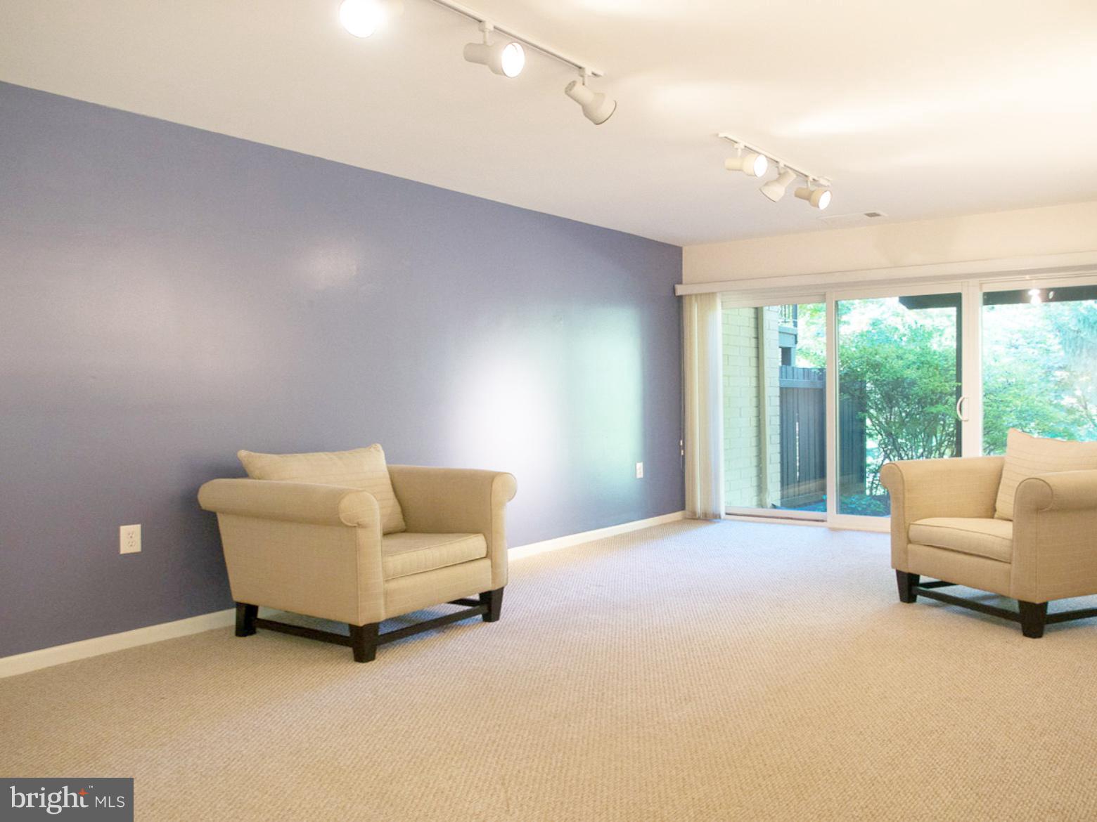 11168 Saffold Way Reston, VA 20190 - Photo 18 of 28 a living room with furniture and a large window