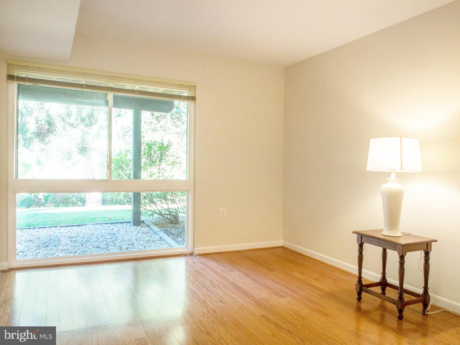 11168 Saffold Way Reston, VA 20190 - Photo 20 of 28 a view of workspace room with wooden floor and window