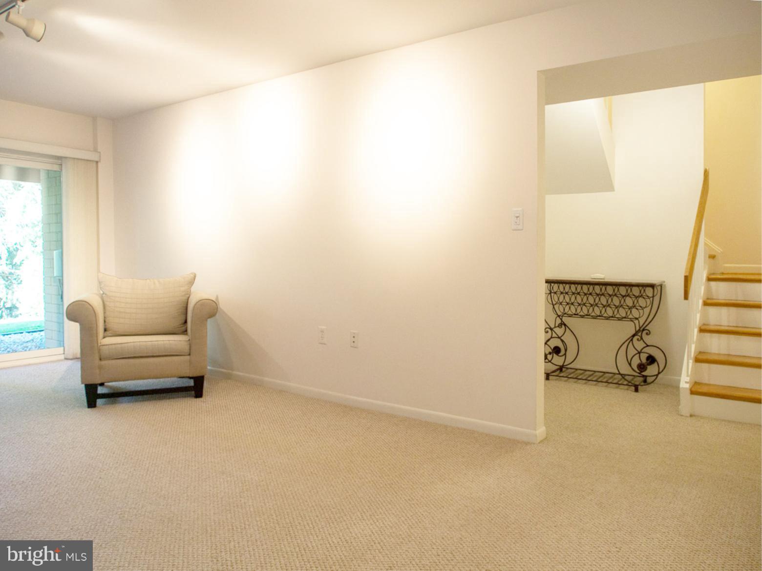 11168 Saffold Way Reston, VA 20190 - Photo 21 of 28 a living room with furniture and a window