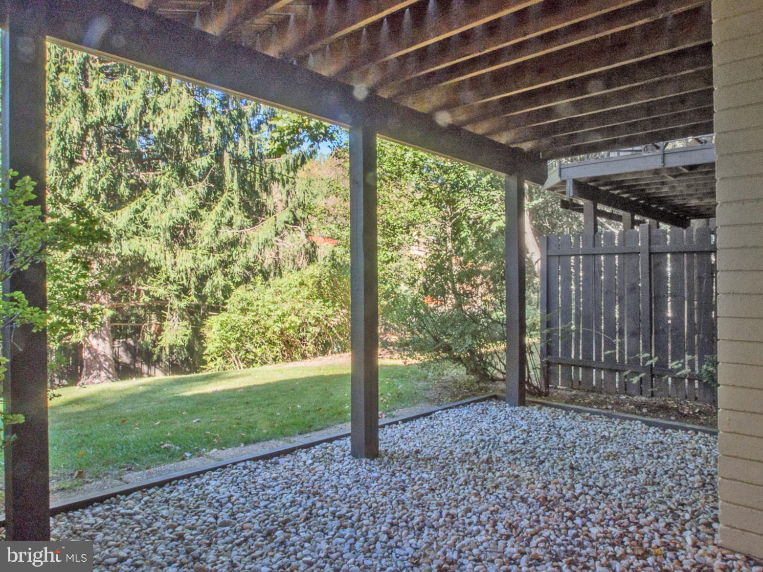 11168 Saffold Way Reston, VA 20190 - Photo 22 of 28 a view of a backyard with large trees