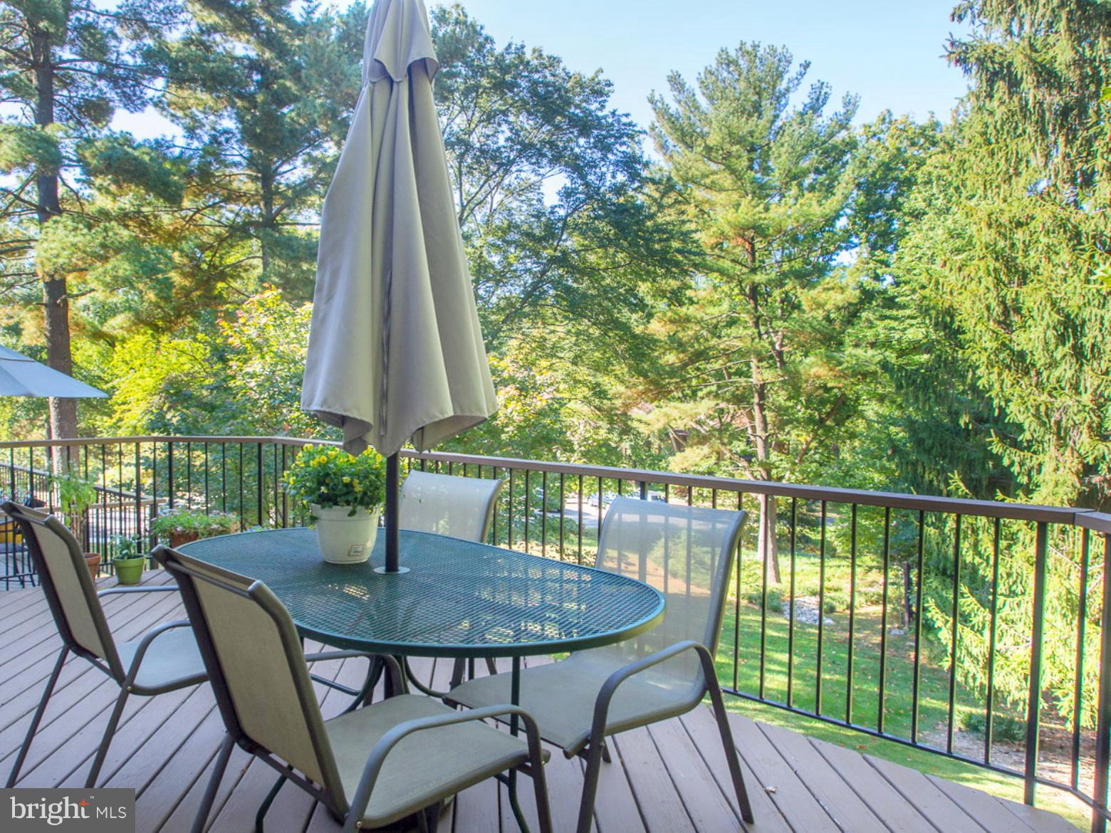 11168 Saffold Way Reston, VA 20190 - Photo 27 of 28 a view of a balcony with a table and chairs