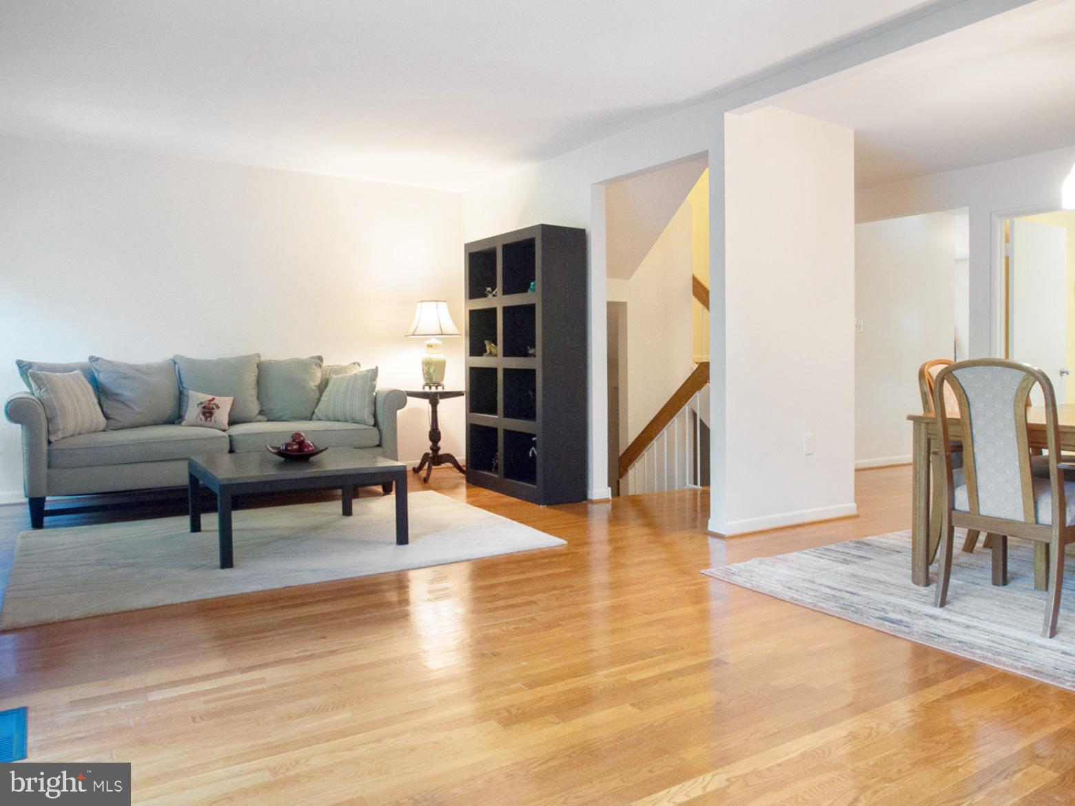 11168 Saffold Way Reston, VA 20190 - Photo 8 of 28 a living room with furniture and wooden floor