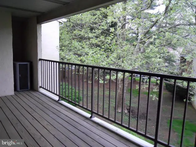 a view of balcony with wooden floor