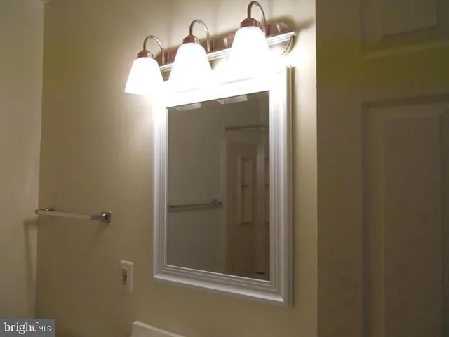 a bathroom with a sink and mirror