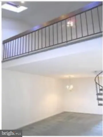 a view of staircase with white walls