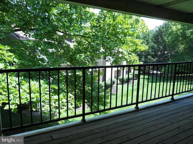 a view of balcony with wooden floor