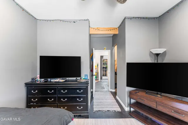 a room with furniture and a flat screen tv