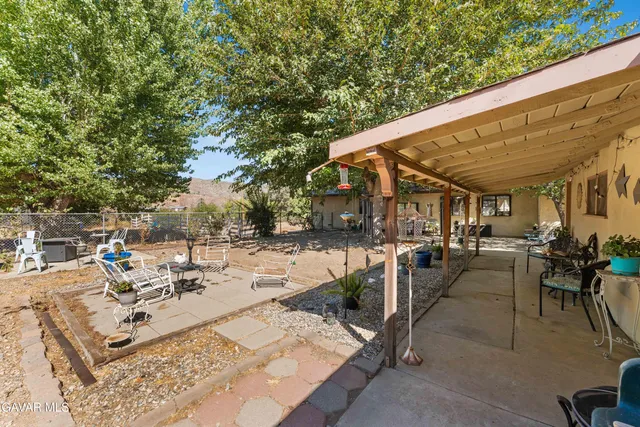 a view of a patio with chairs and tables