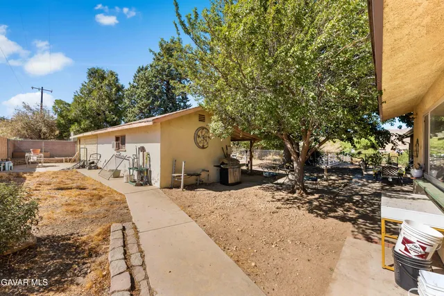 a view of a back yard of the house