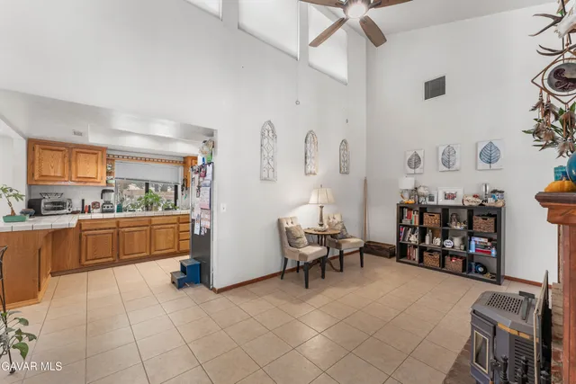 a kitchen with stainless steel appliances cabinets and a table