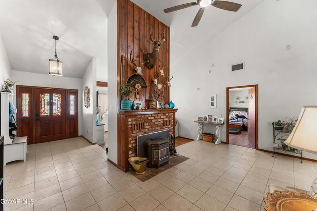a view of a livingroom with furniture and a fireplace