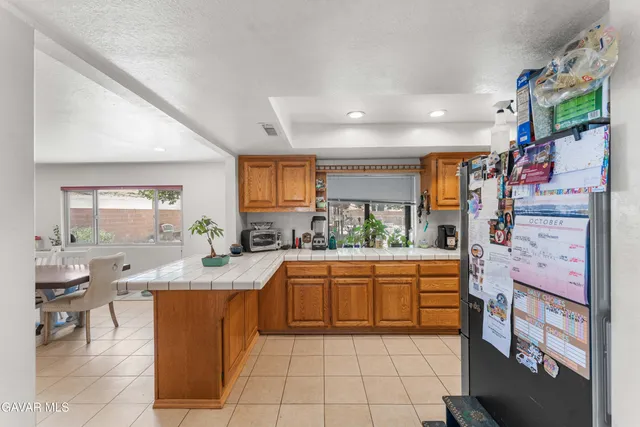 a kitchen with stainless steel appliances granite countertop a sink and cabinets