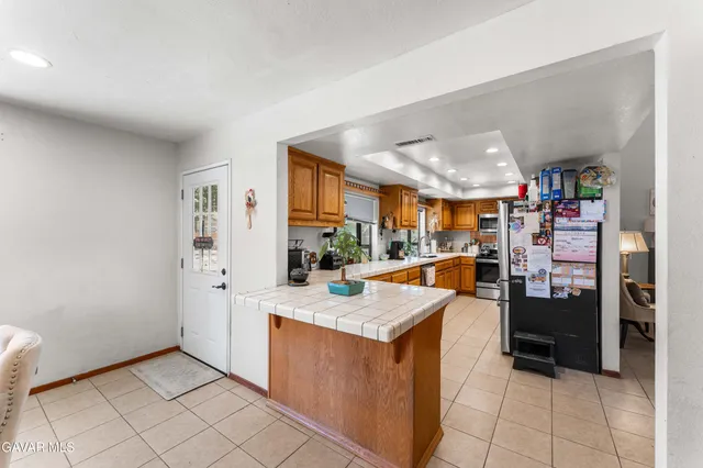 a view of a kitchen and utility room