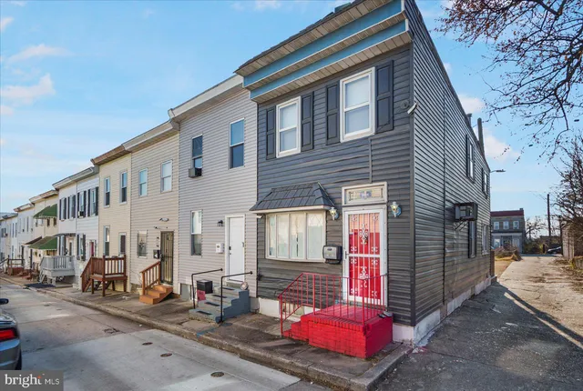 a front view of a house with parking space