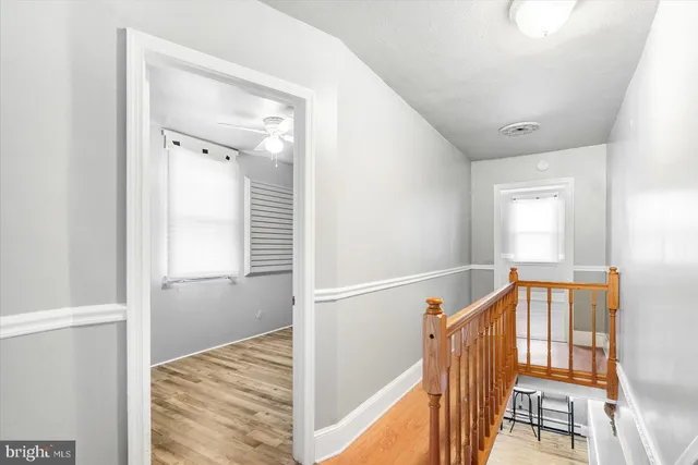 a view of an entryway with wooden floor